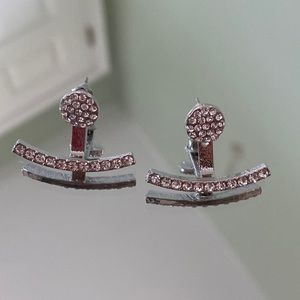 Silver stud earrings with a silver jacket cuff
